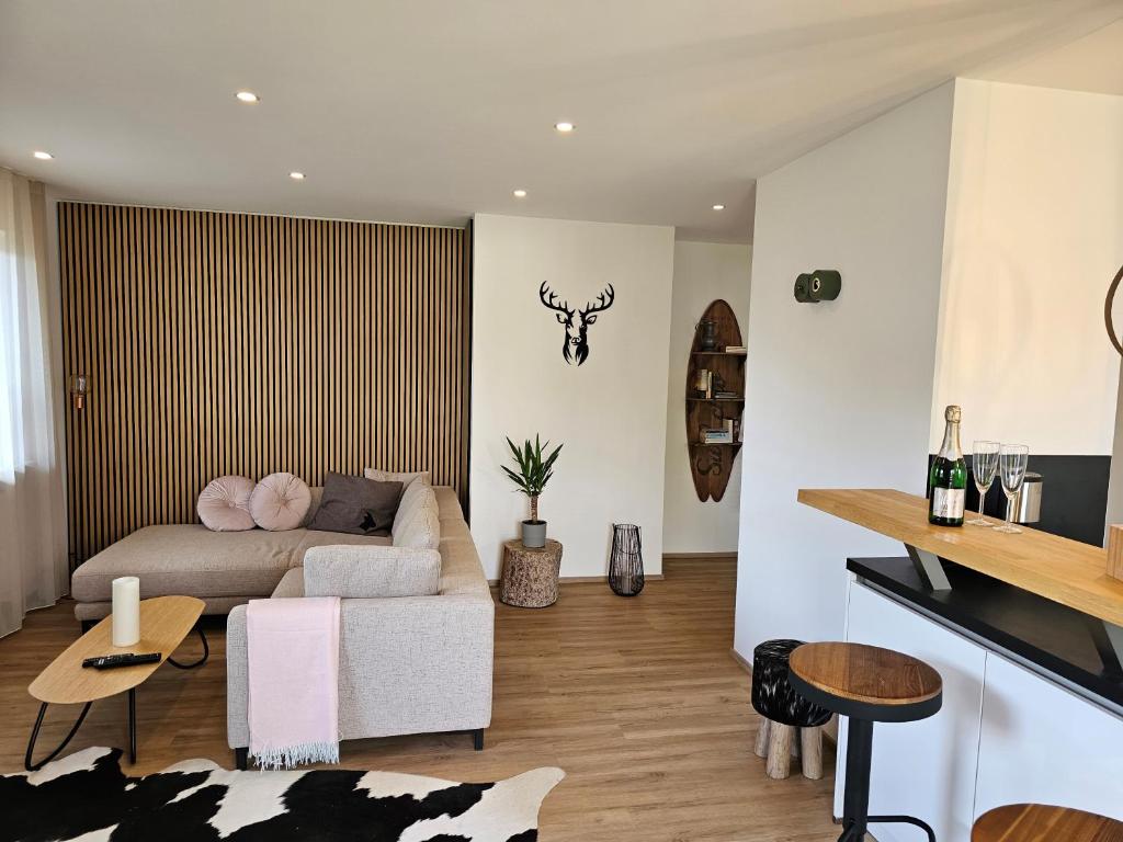 a living room with a couch and a table at Ferienwohnung Messinger in Seebruck