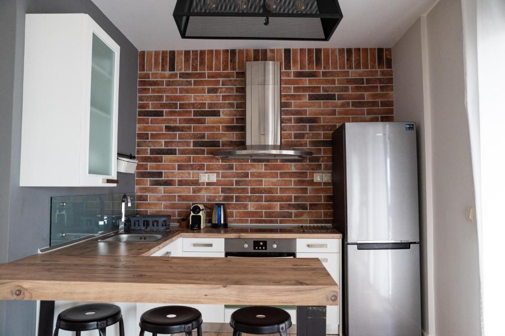 Kuchyň nebo kuchyňský kout v ubytování Cos Seafront Apartments