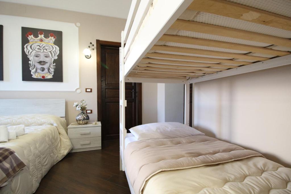 Postel nebo postele na pokoji v ubytování Casa 4 Archi