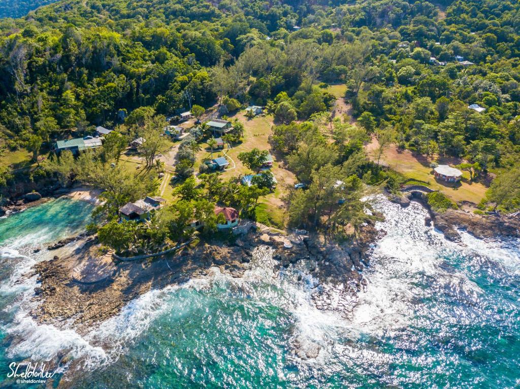 an aerial view of an island in the ocean at Strawberry Fields Together in Robins Bay