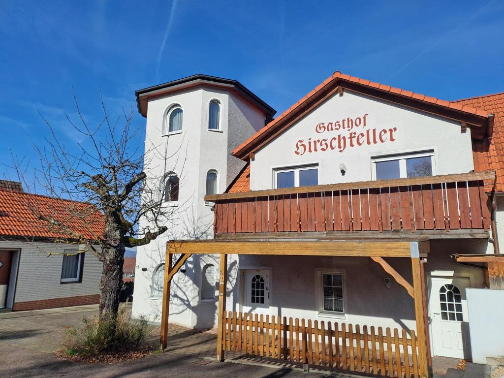 a building with a sign on the side of it at Gasthof Hirschkeller in Göppingen