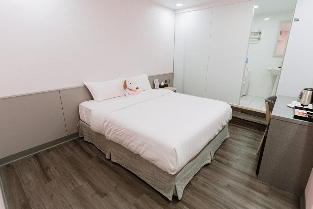Postel nebo postele na pokoji v ubytování 歐法行旅 O Fun Hotel