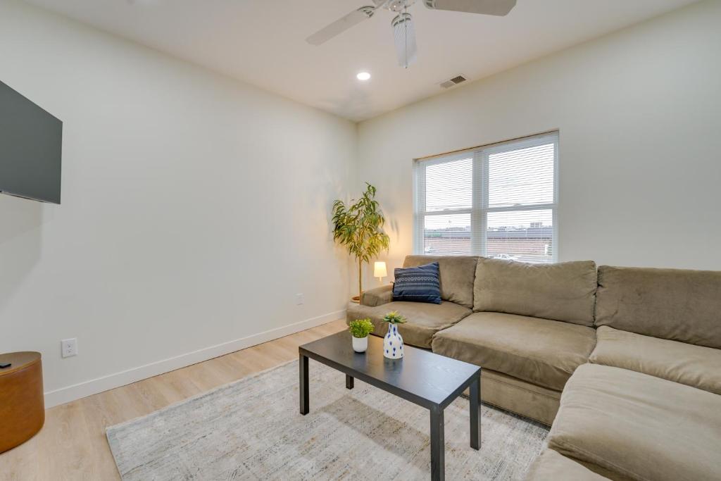 a living room with a couch and a table at St Clair Apartment Near St Clair City Boat Harbor! in Marysville