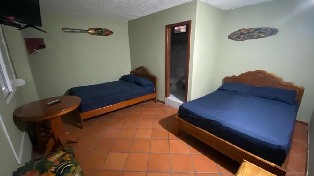Postel nebo postele na pokoji v ubytování Residencial El Valle