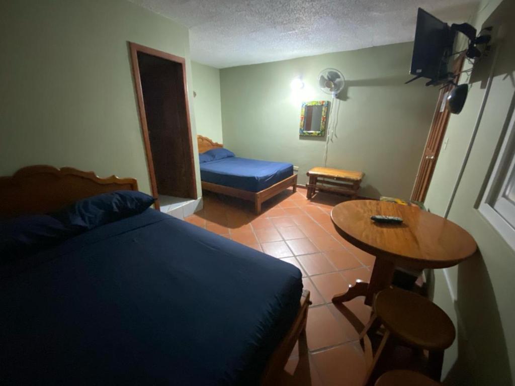 Postel nebo postele na pokoji v ubytování Residencial El Valle