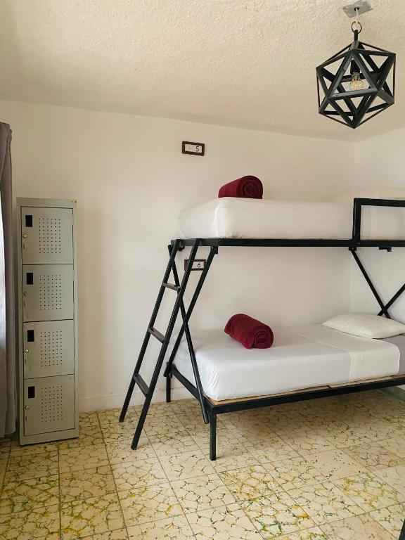 Postel nebo postele na pokoji v ubytování Lool Beh Hostal