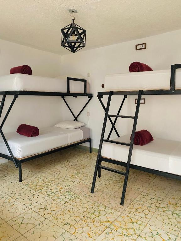 Postel nebo postele na pokoji v ubytování Lool Beh Hostal