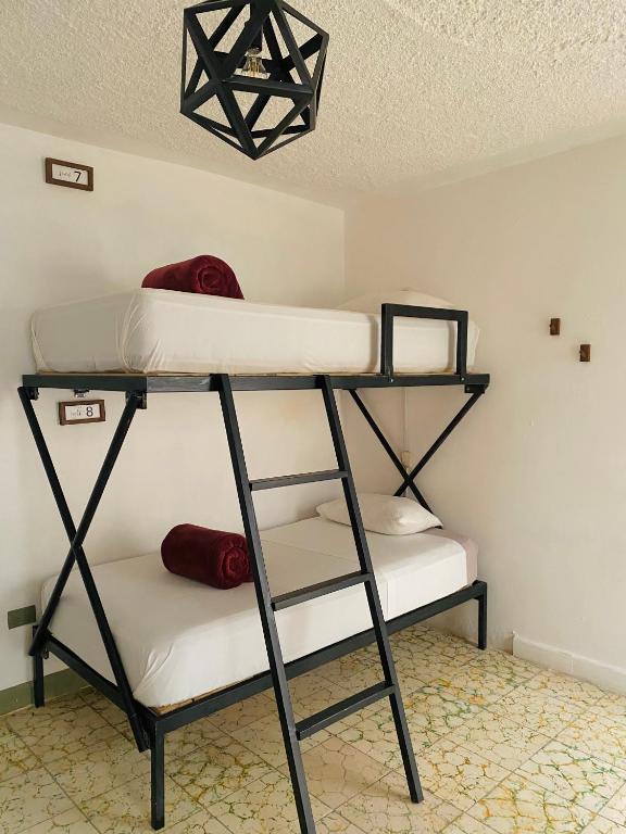 Postel nebo postele na pokoji v ubytování Lool Beh Hostal