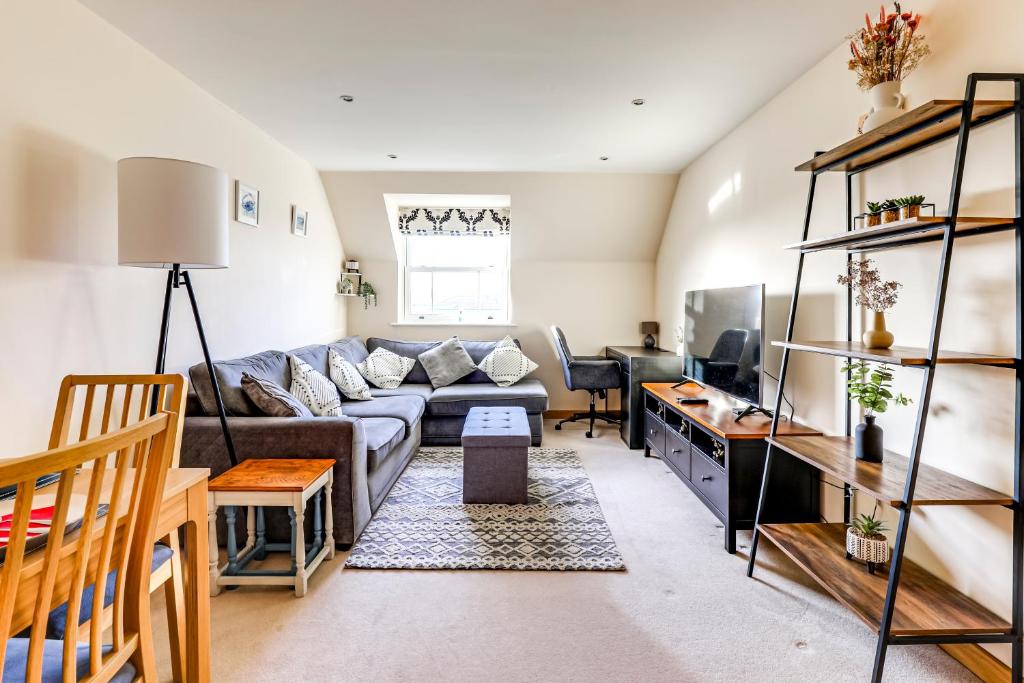 a living room with a couch and a table at Entire 2 Bed Flat Contractors Families and Relocators in Ware