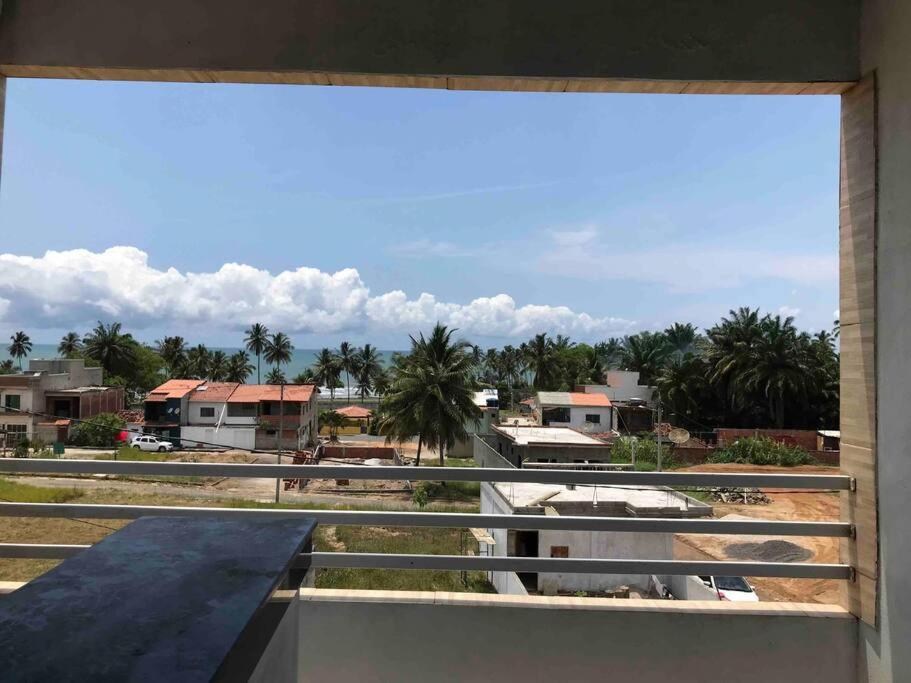 a view of a city from a balcony at Casa de Veraneio IOS in Ilhéus