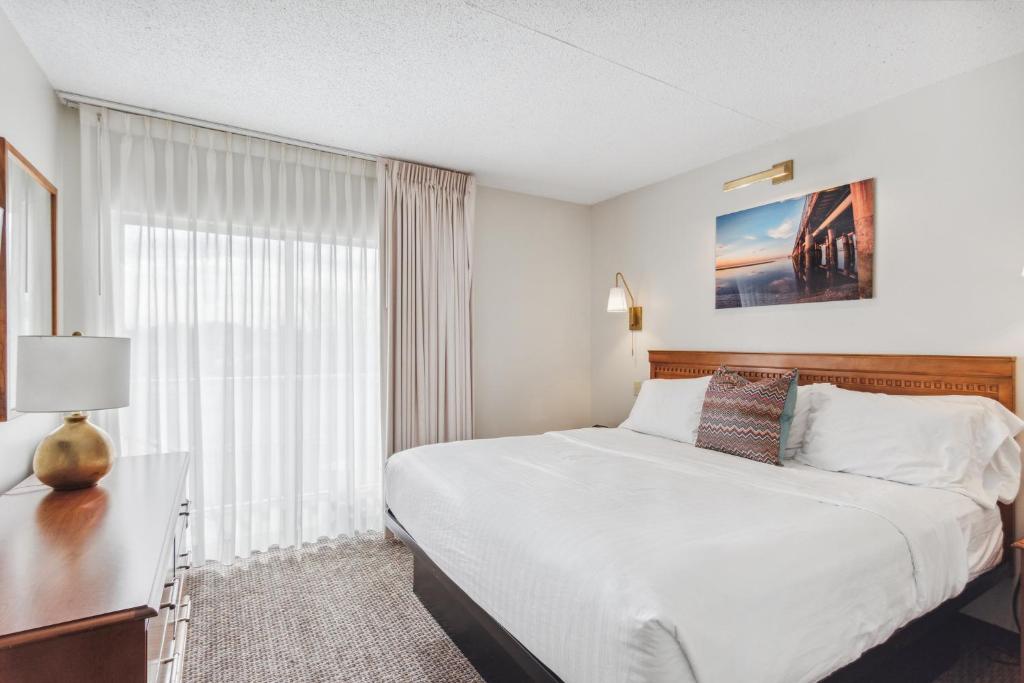 a hotel room with a bed and a window at Cape Suites Room 2 - Free Parking! Hotel Room in Rehoboth Beach