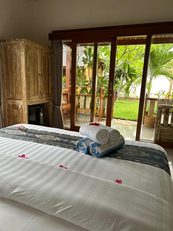 Postel nebo postele na pokoji v ubytování Unzipp Bungalows Gili Air