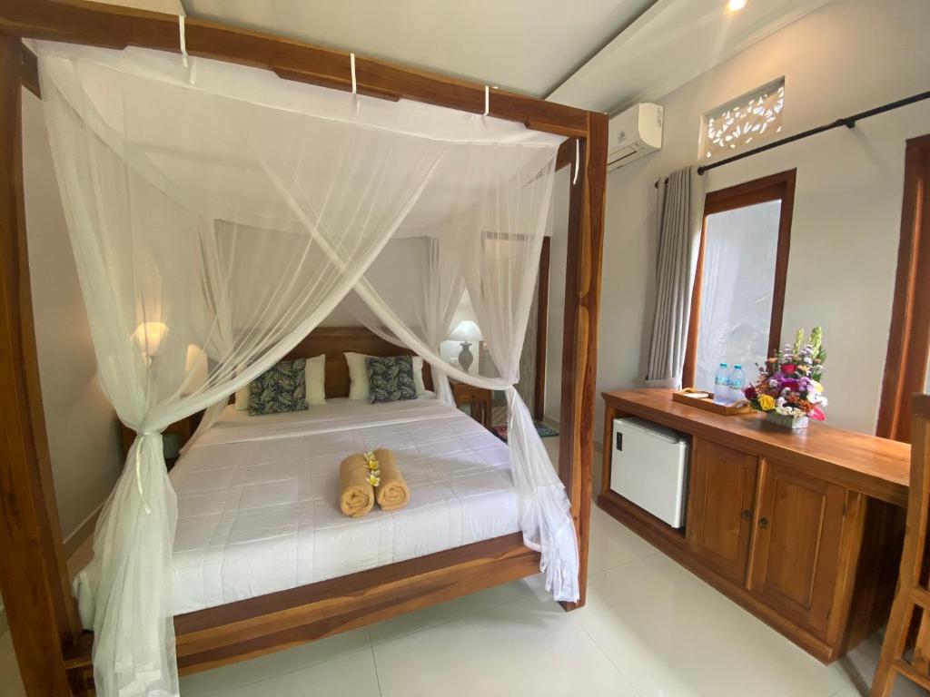 Letto o letti in una camera di GUS ARDITYA HOMESTAY