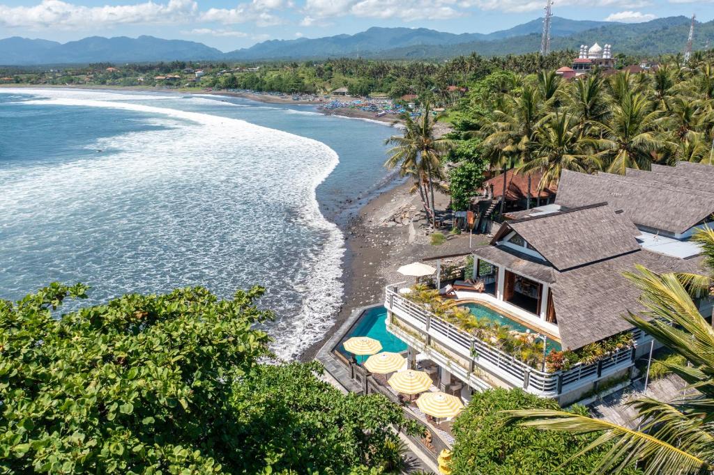 an aerial view of a resort and the beach at Bombora Medewi in Pulukan