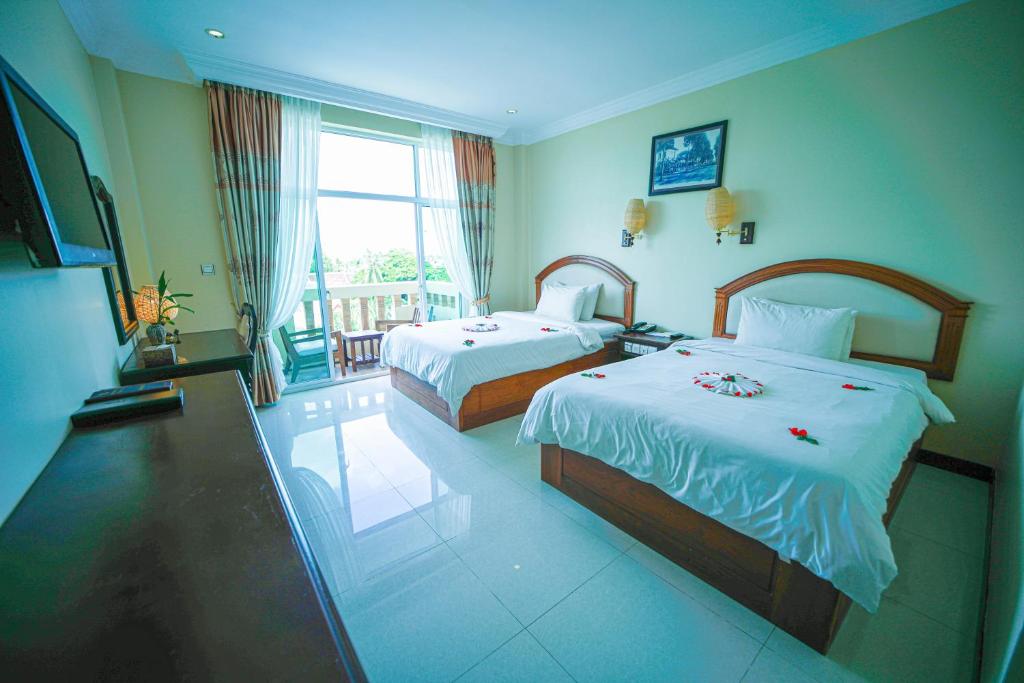 Postel nebo postele na pokoji v ubytování Classy Hotel & Spa