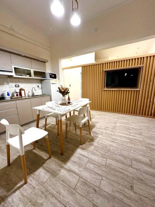 a kitchen with a table and chairs in a room at Martita House in Clorinda