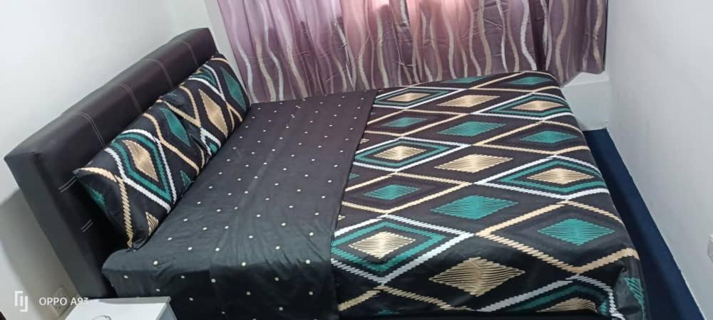 Postel nebo postele na pokoji v ubytování Hotel Blue Orchid