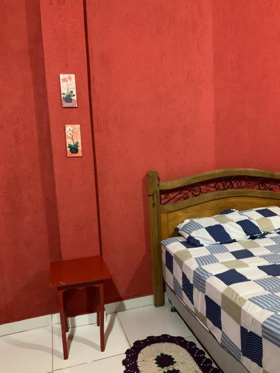 a bedroom with a bed and a table in a room at Bed and Breakfast 879 in Asunción