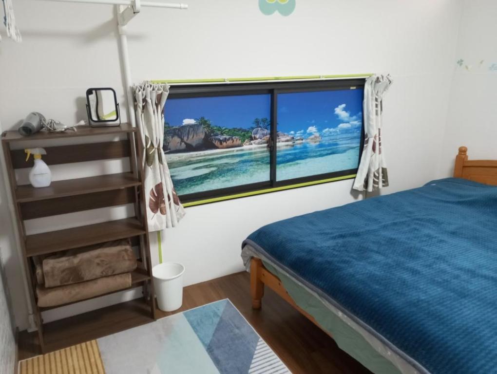 Postel nebo postele na pokoji v ubytování Mike's B&B Tokoname
