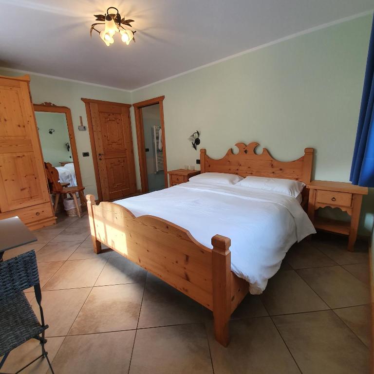 Postel nebo postele na pokoji v ubytování Hotel Chalet val di Rabbi