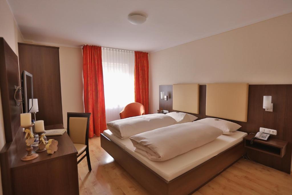 Postel nebo postele na pokoji v ubytování Hotel Bockmaier