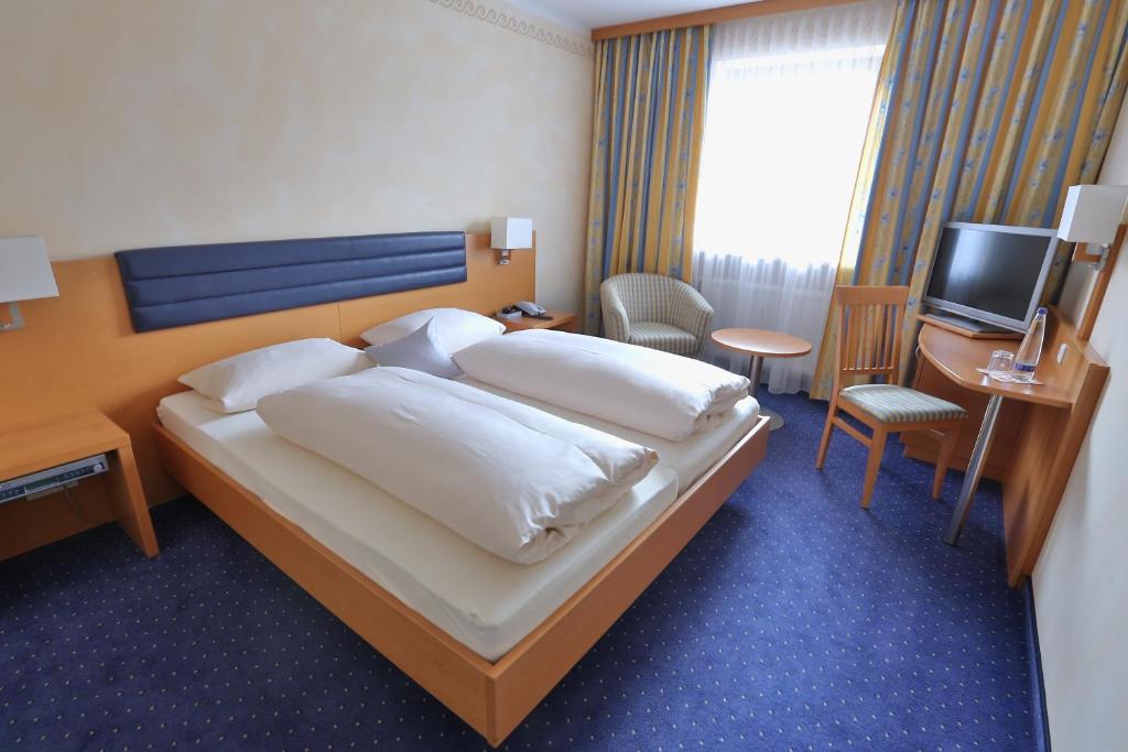 Postel nebo postele na pokoji v ubytování Hotel Bockmaier