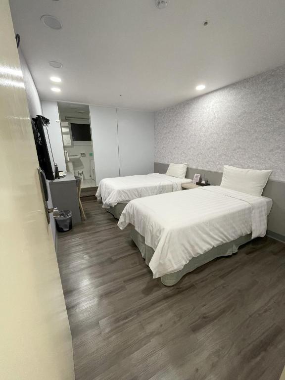 Postel nebo postele na pokoji v ubytování 歐法行旅 O Fun Hotel