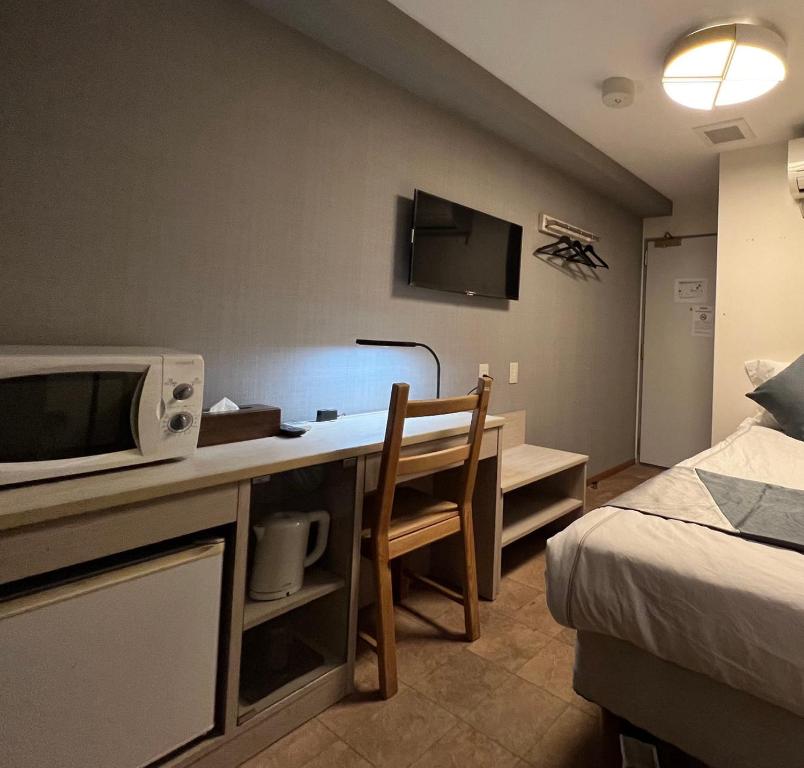 TV a/nebo společenská místnost v ubytování Le Tour Hotel Akihabara Kanda 楽途ホテル神田秋葉原