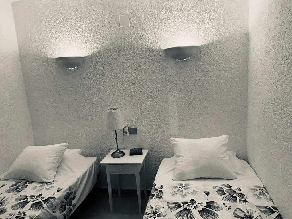 Postel nebo postele na pokoji v ubytování Jávea Villa entière piscine et cuisine d'été à pinosol