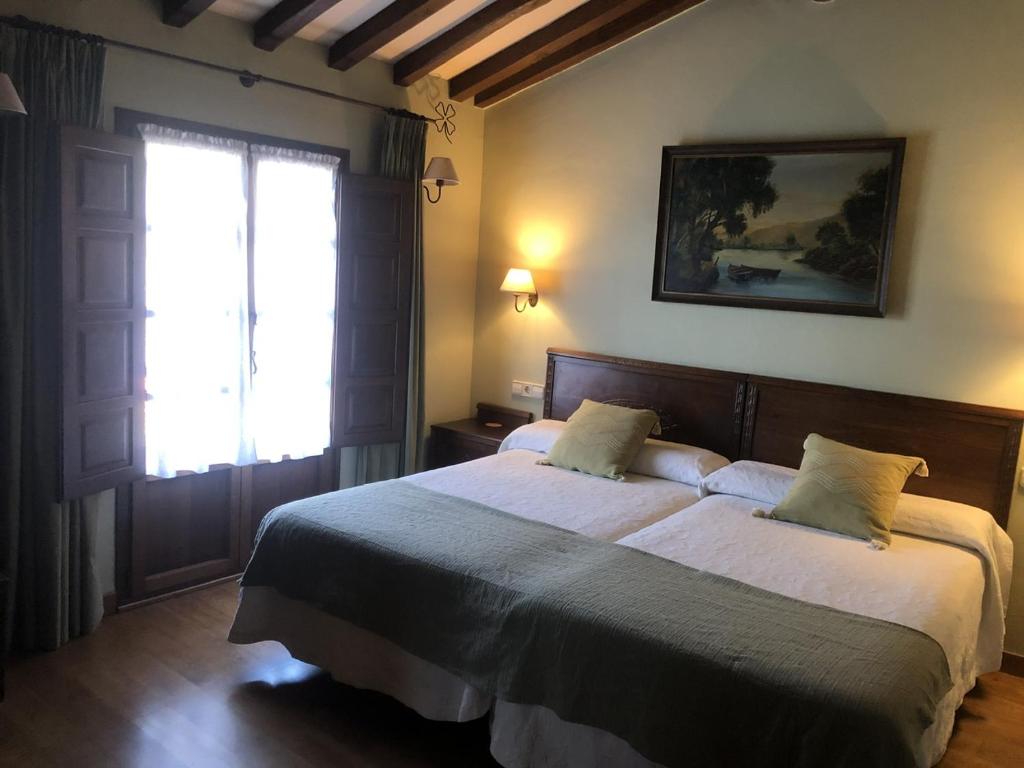 Postel nebo postele na pokoji v ubytování Casa Rural Trebol4Hojas