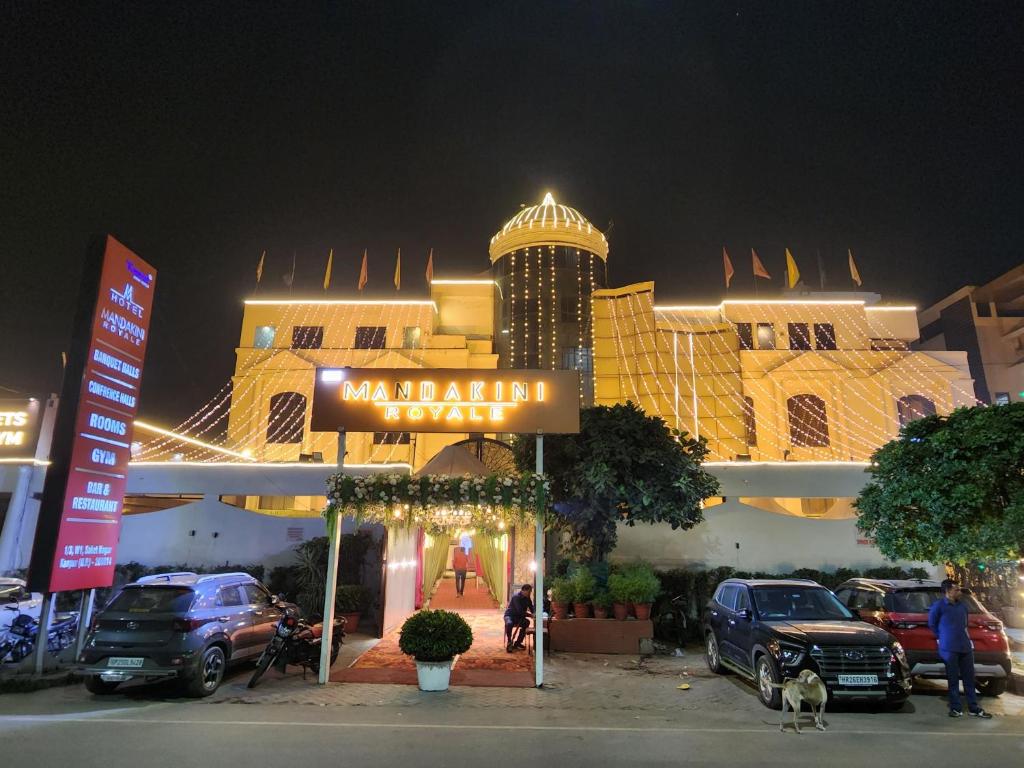 a large building with a sign in front of it at Hotel Mandakini Royale in Kānpur
