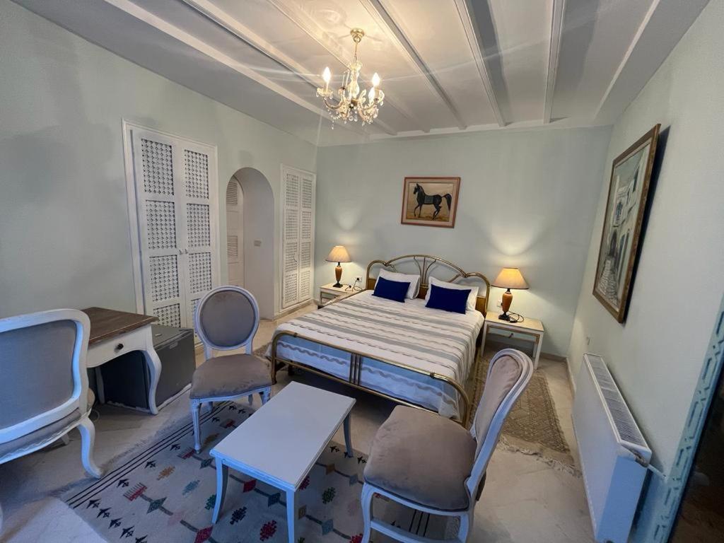 Postel nebo postele na pokoji v ubytování Dar Yessine Boutique Hôtel