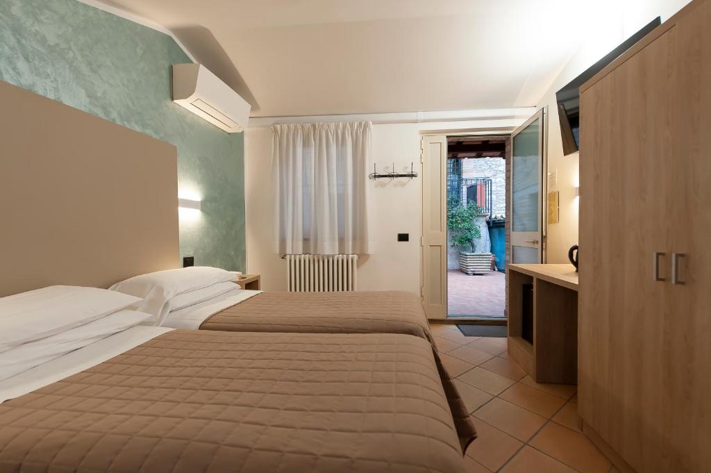 Postel nebo postele na pokoji v ubytování Hotel Sole