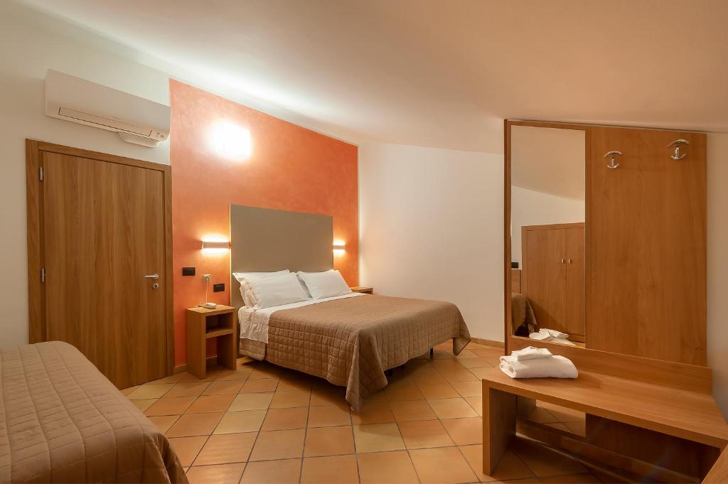 Postel nebo postele na pokoji v ubytování Hotel Sole
