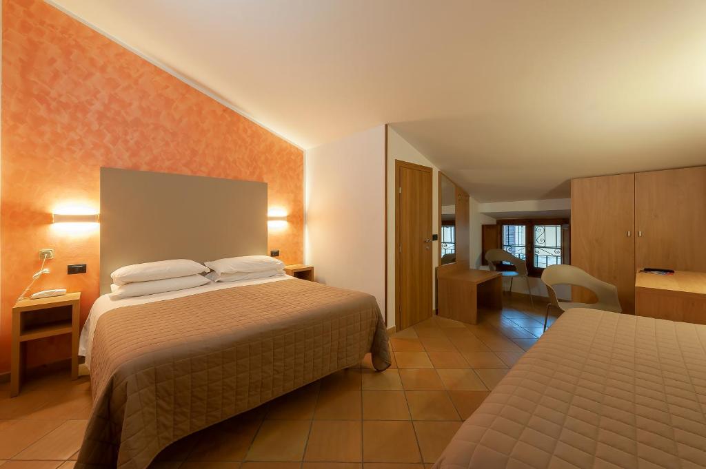 Postel nebo postele na pokoji v ubytování Hotel Sole