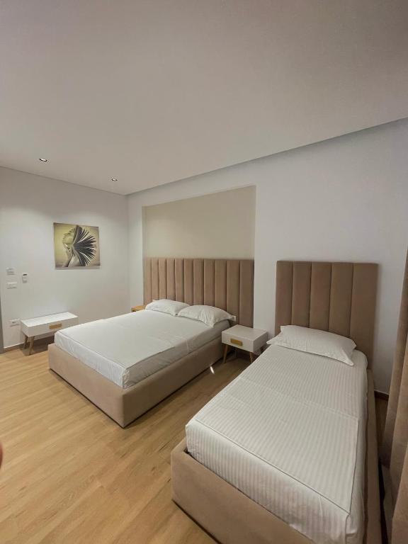Postel nebo postele na pokoji v ubytování Sea & Sand Hotel
