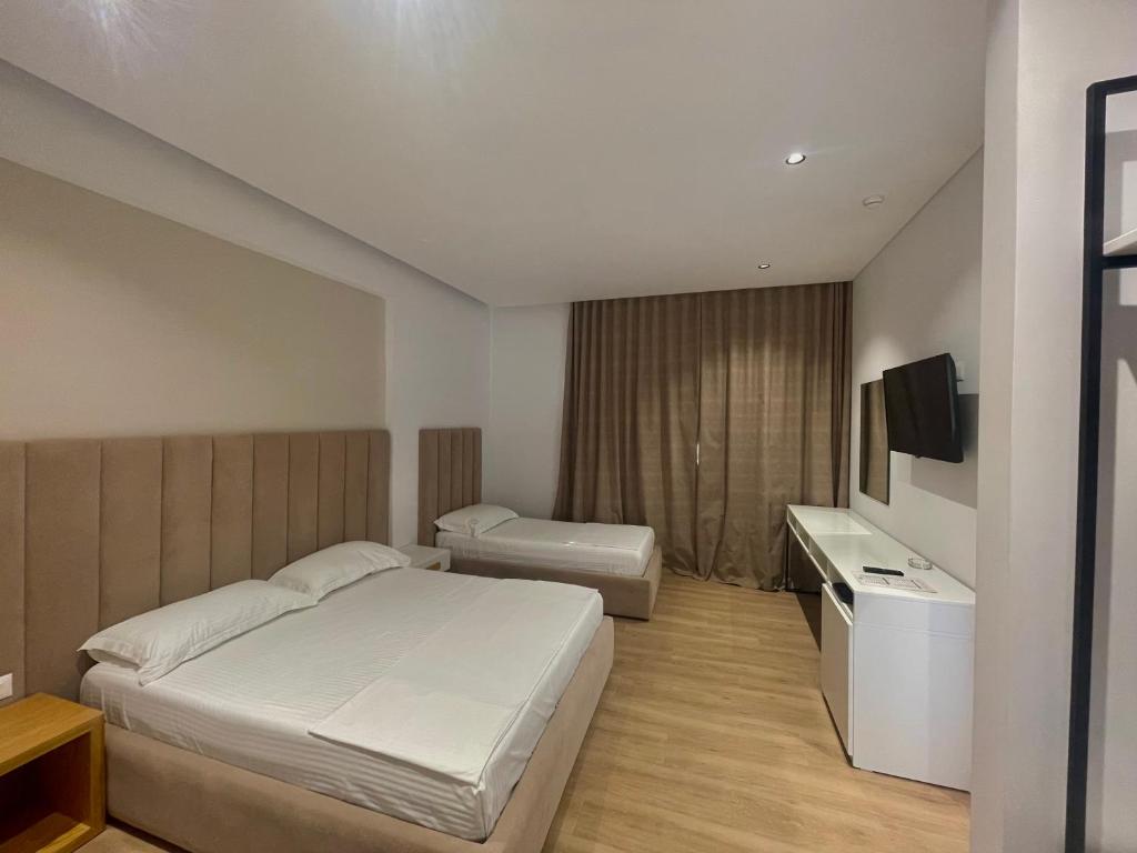 Postel nebo postele na pokoji v ubytování Sea & Sand Hotel