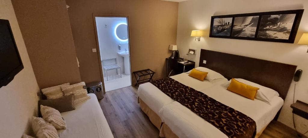 Postel nebo postele na pokoji v ubytování Hotel le Bellevue