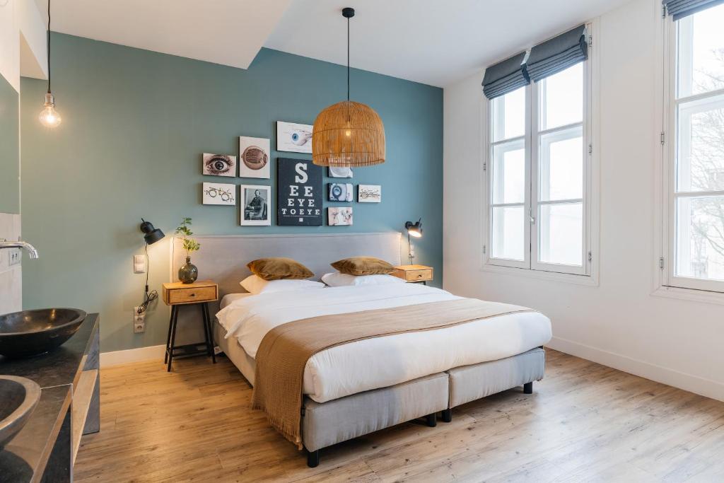 Postel nebo postele na pokoji v ubytování Eye Hotel