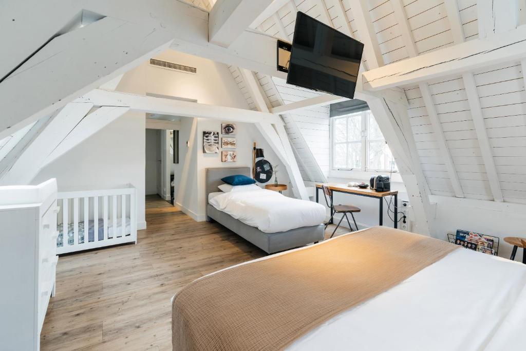 Postel nebo postele na pokoji v ubytování Eye Hotel