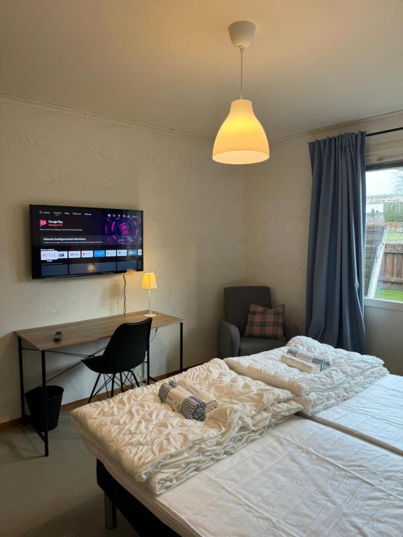 Ένα ή περισσότερα κρεβάτια σε δωμάτιο στο Workershotel Mariestad