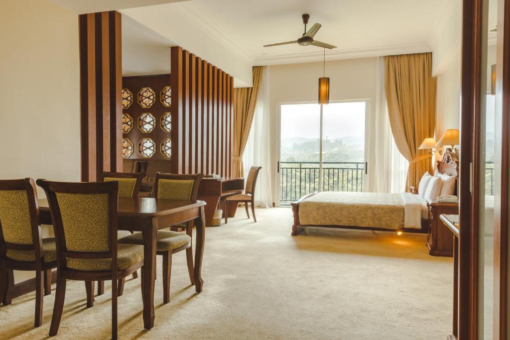 Postel nebo postele na pokoji v ubytování Heritage Hotel Cameron Highlands