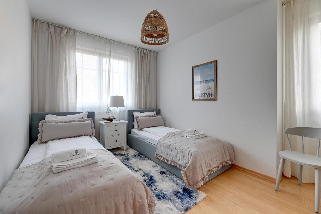 Postel nebo postele na pokoji v ubytování Amalfi - Quiet Family Stay by Lion Apartments Sopot