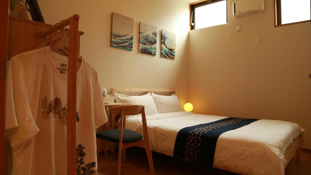 Postel nebo postele na pokoji v ubytování E JOY INN-West Shinjuku Branch