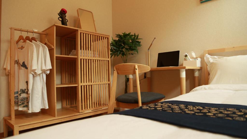 Postel nebo postele na pokoji v ubytování E JOY INN-West Shinjuku Branch