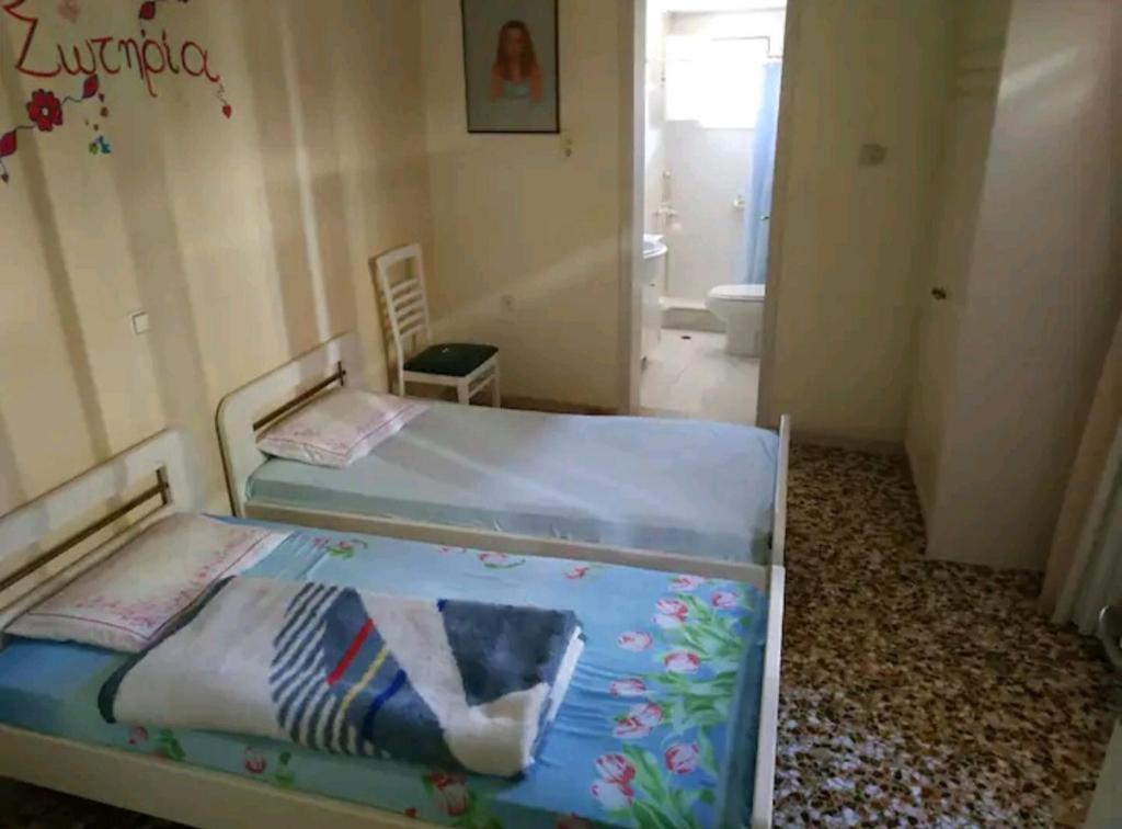 Postel nebo postele na pokoji v ubytování IOANNIS