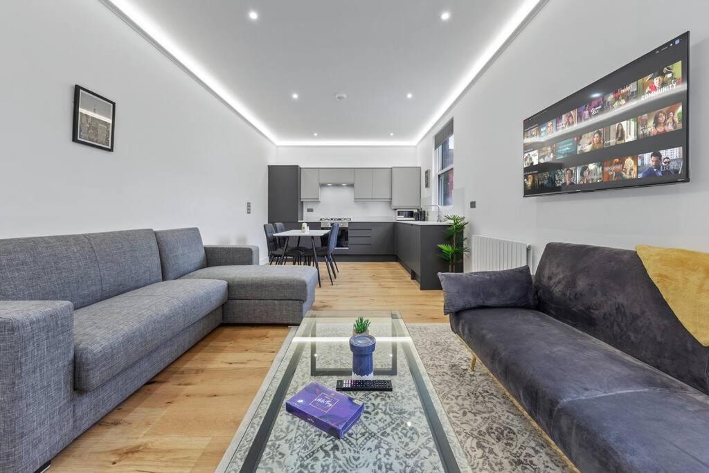 a living room with a couch and a table at Brand new Apartment near London Bridge LR1 in London