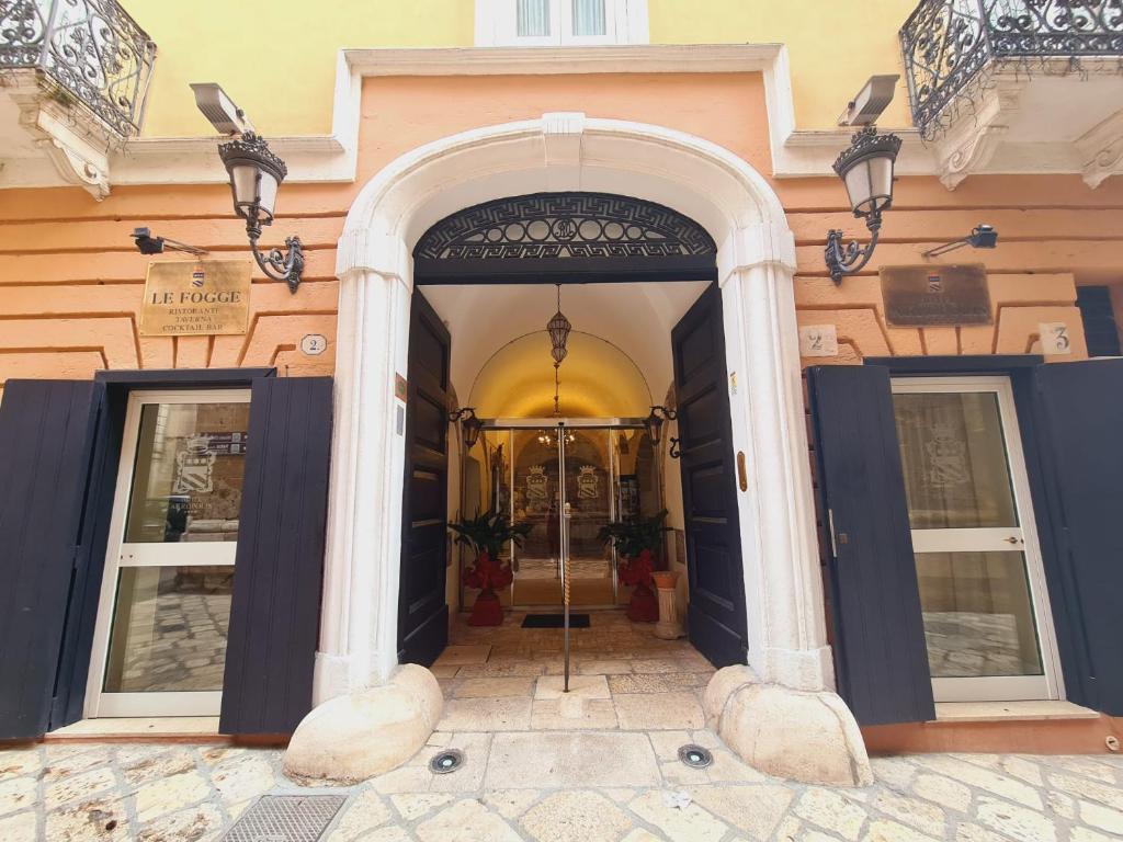 an entrance to a building with two doors at Hotel Akropolis - Museum Hotel in Taranto