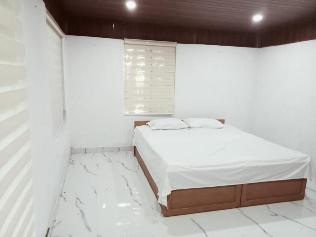 Ένα ή περισσότερα κρεβάτια σε δωμάτιο στο PETERCOTTAGE HOMESTAY