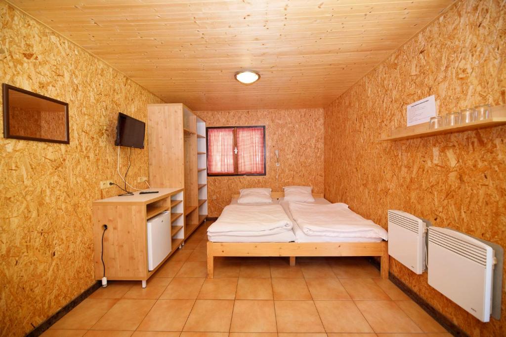 Letto o letti in una camera di Chatový areál Zděřina